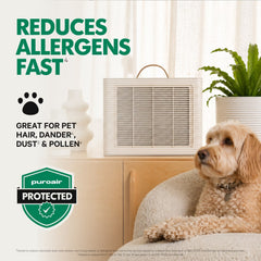 PuroAir Lite air purifier with dog sitting next to it